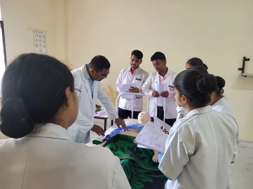 Indian medical students learning clinical skills with a training mannequin; illustrative stock photograph